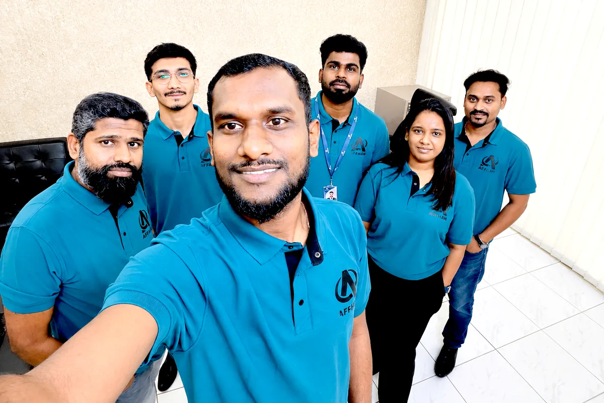 The six-person AFFHAN Dubai team in branded uniform at the company's UAE office